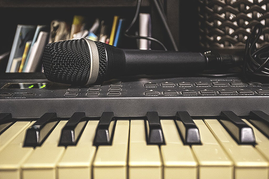 Home recording with microphone and piano keyboard